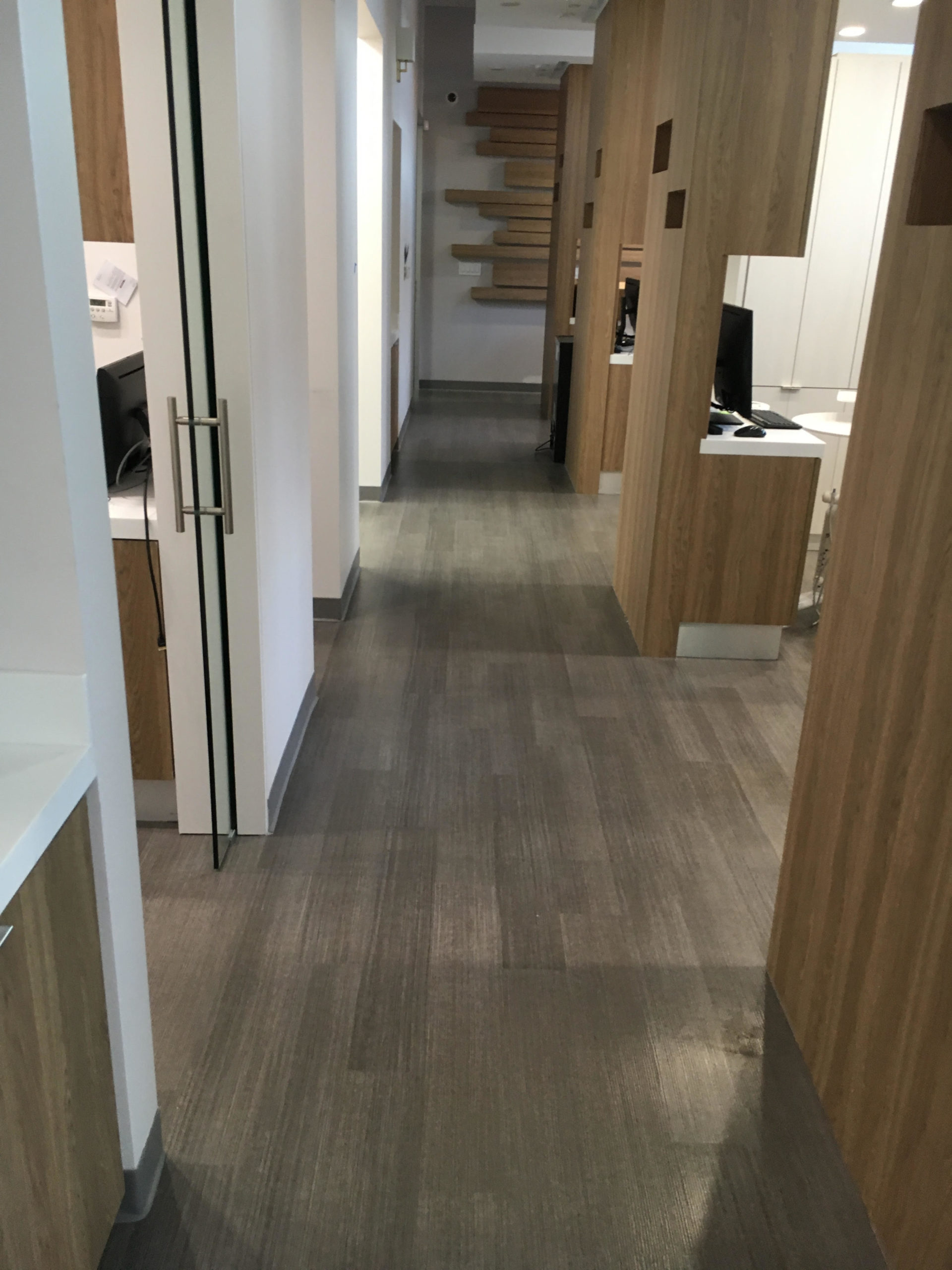 Dental Office in San Francisco with a new luxury vinyl plank flooring installed on concrete subfloor.