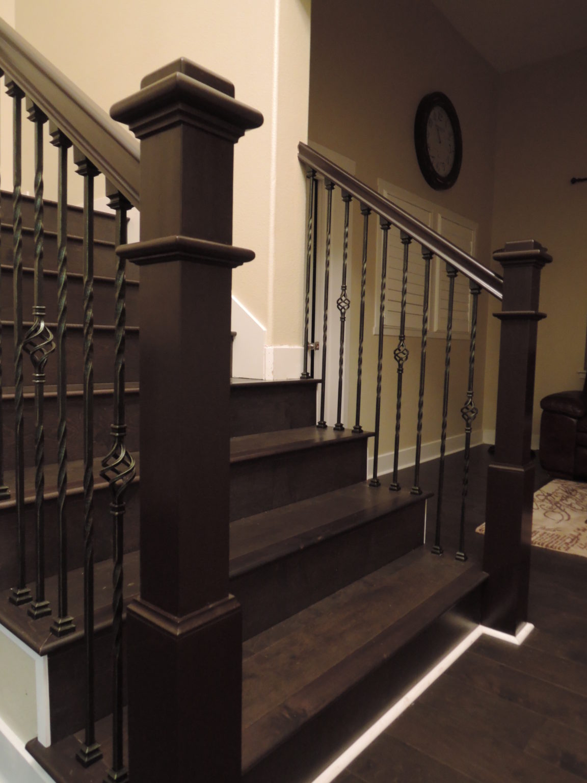 Remodeled stairs with new metal spindles and new laminate treads and